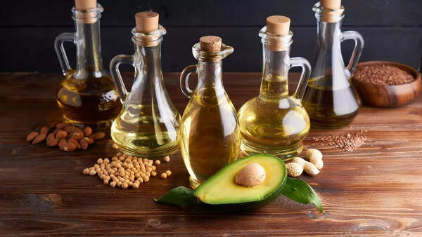 Selection of various hair oils with different ingredients.