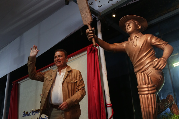 Sunil Gavaskar posing with his life-size statue